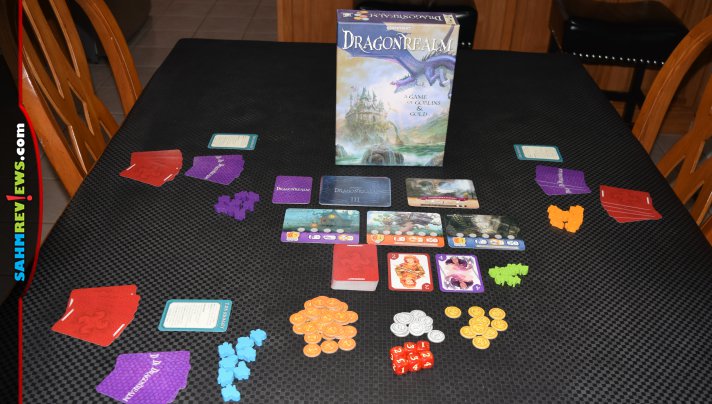 Dragonrealm by Gamewright is the follow up to the extremely successful Dragonwood. It turns up the complexity a bit, but is still accessible to new players! - SahmReviews.com